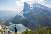 Hiking Backpacker on a high ledge 