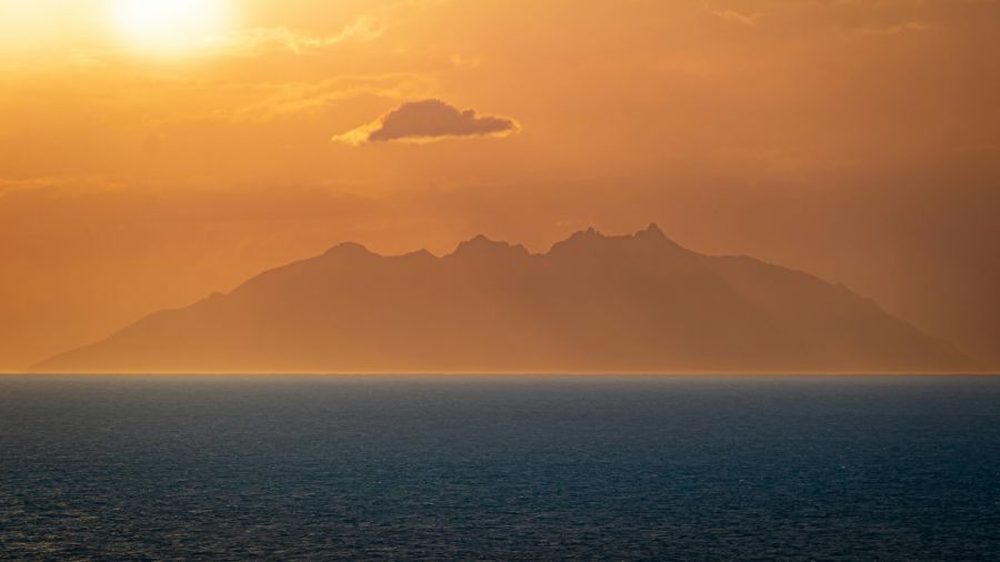 Extremism Far distant islet during sunset surrounded by the sea isola del giglio,italy,water