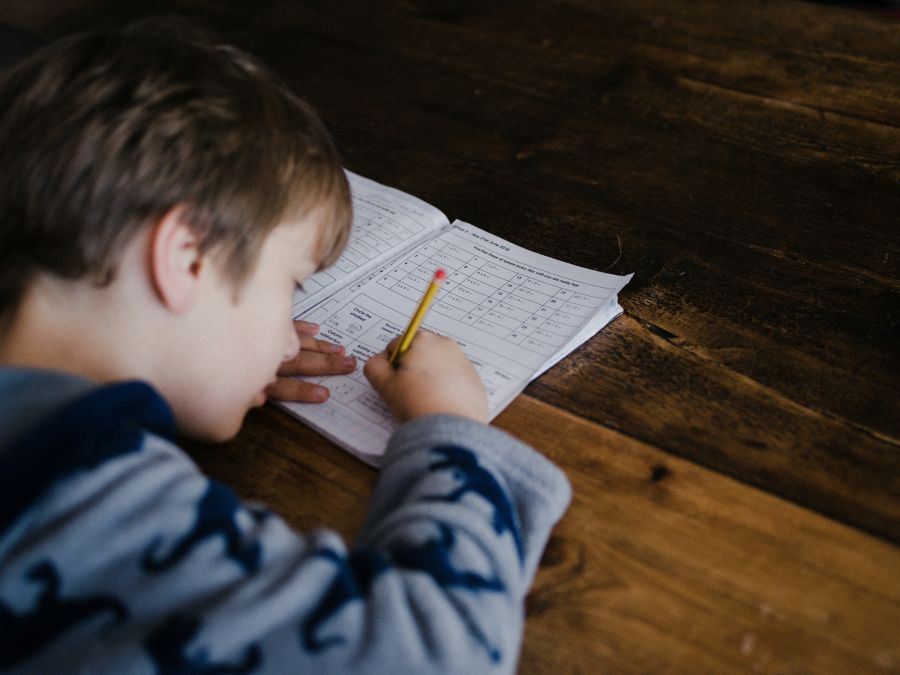 children education Child completing maths homework 