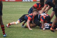 Rugby player The forwards push the scrum during a youth club rugby game, as one young man in a red and blue shirt looks up to see where the ball has gone.  team,sport,youth