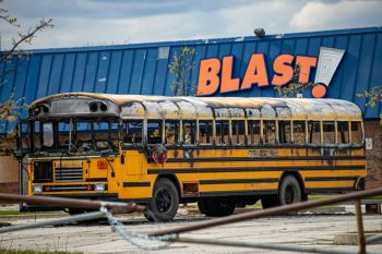 bus fire Blast - burned school bus in the parking lot 