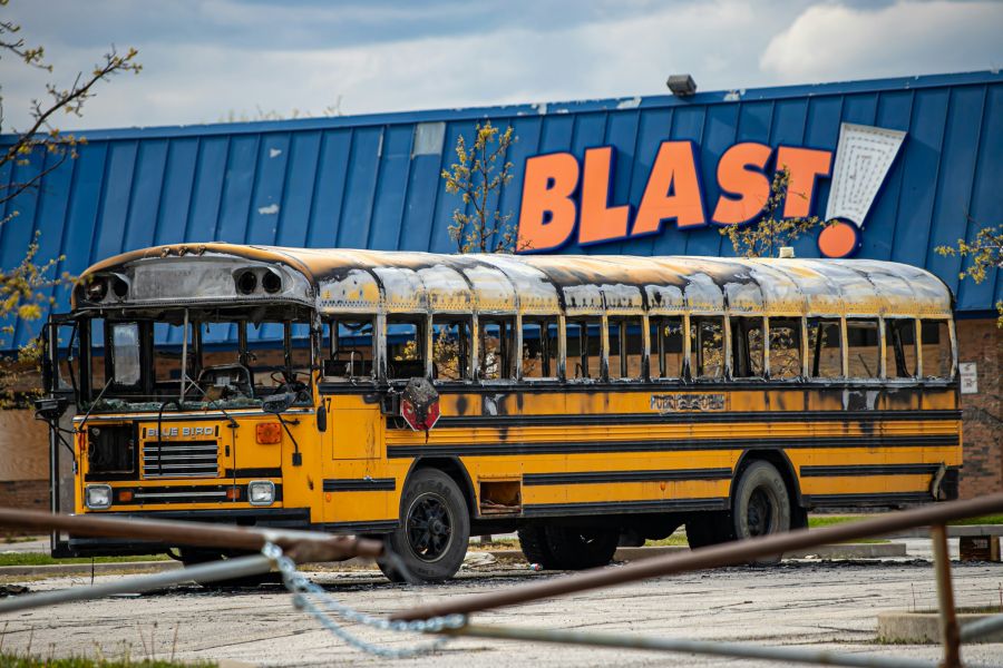 bus fire Blast - burned school bus in the parking lot 