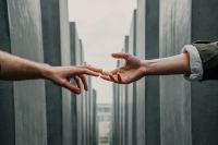 Marriage couple jewish memorial berlin - human reconnection between love and hate hands,help,hand