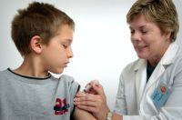 Wildfire prevention The nurse depicted in this 2006 photograph was in the process of administering an intramuscular vaccination in the left shoulder of a young boy. The nurse was pinching the overlying shoulder skin, in order to immobilize the injection site. doctor,immunization week,disease control